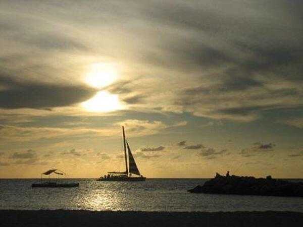 A peaceful, golden Caribbean sunset.