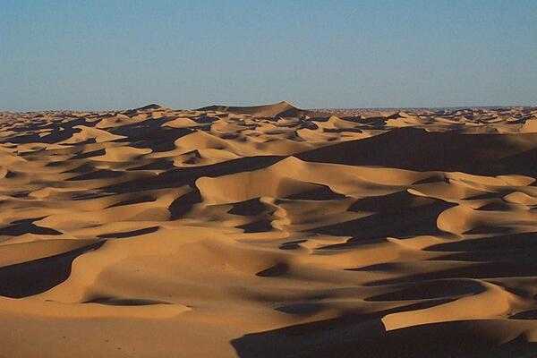 The Sahara Desert covers large parts of Algeria, Chad, Egypt, Libya, Mali, Mauritania, Morocco, Niger, Sudan, and Tunisia, with an area measuring approximately 9,200,000 sq km (3,600,000 sq mi). It is the largest hot desert in the world and the world’s third-largest desert, after Antarctica and the Arctic. The name "Sahara" comes from the Arabic word sahra meaning "desert.”