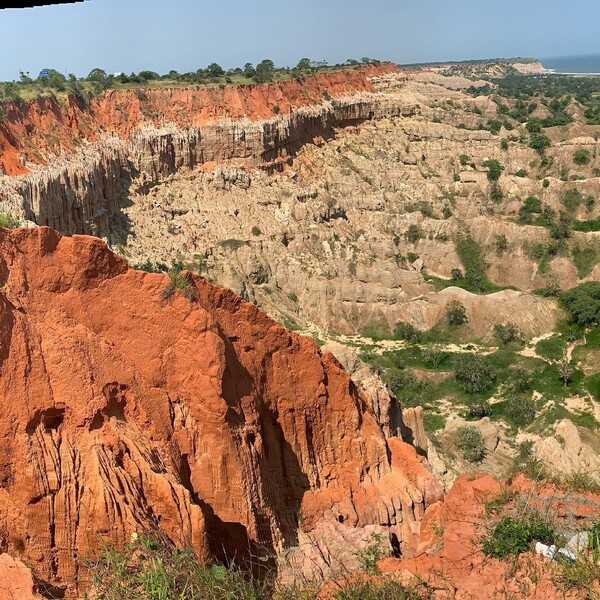 Located 40 km south of Luanda is the stunning geologic formation known as Miradouro da Lua (Portuguese for “Viewpoint of the Moon”). The distinctive tri-color (orange, white, tan) set of cliffs was carved by wind and rain erosion and to some looks like a setting from another planet or, per the name, the moon.
