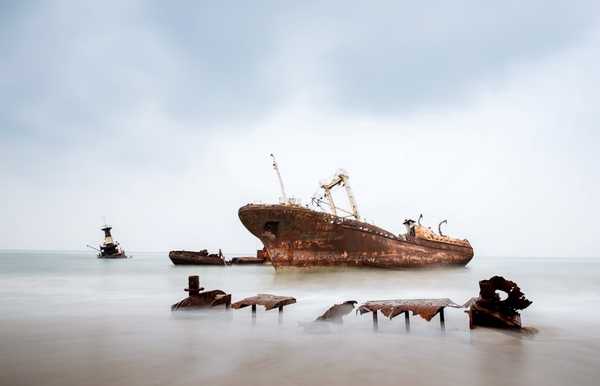 Located  some 30 km north of Luanda, Angola's capital, is 2.5 km-long Shipwreck Beach. The area acquired its name when in the 1970’s disused ships of bankrupt companies were towed to this remote beach forming a ship graveyard. The ships date back to the 1960’s with the largest of the over 20 rusting hulks being an oil tanker named "Karl Marx."