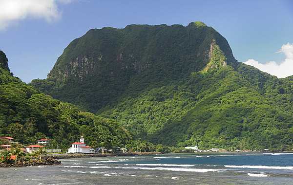 One of the seven National Natural Landmarks located on the opposite side of Pago Pago Harbor, Rainmaker Mountain is a great mass of volcanic rocks extruded as molten magma during major episodes of volcanism that created Tutuila island. Photo courtesy of the US National Park Service.