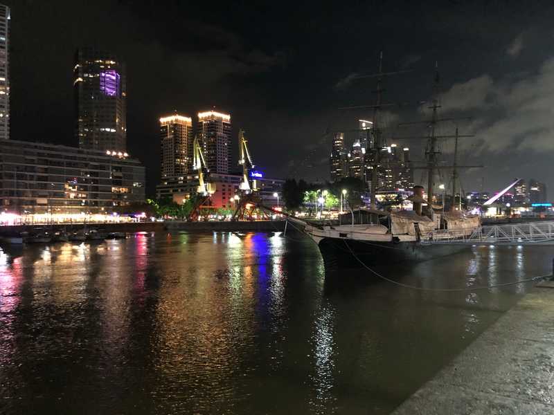 The Rio Darsena Sur is the historical location of Buenos Aires' protected harbor area known as Puerto Madero.  Now revitalized, the old port is filled with hotels, shops, and restaurants with a city walk along both shores. Also pictured here is the corvette ARA Uruguay that once sailed with the Argentine Navy. Built in 1874, the ship may be the oldest in South America. Having served as a gunboat, training ship,  expedition support ship, Antarctic rescue ship, and hydrographic survey vessel, it now greets visitors in Puerto Madero as a floating museum.