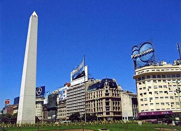The Obelisk (El Obelisco) along Avenida 9 de Julio in Buenos Aires. The thoroughfare, named after Argentina&apos;s independence day (9 July 1816), is generally considered the widest avenue in the world. The Obelisk, built in 1936, measures 67 meters high (220 feet) and commemorates the founding of the city.