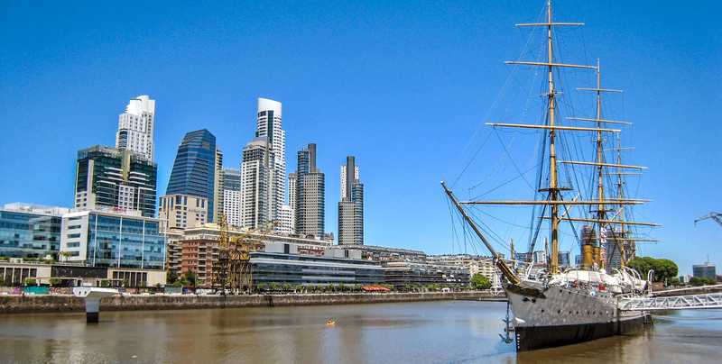 With the opening of Puerto Nuevo (New Port) in Buenos Aires in the early 20th century, Puerto Madero became obsolete and fell into disrepair. For many decades, the area struggled economically resulting in one of the city's most degraded areas. However, beginning in the 1990s and continuing today, local and foreign investment has transformed Puerto Madero into a focal point of interest for tourists and residents alike. Not only is it the largest urban renewal project in Argentina, but it is considered one of the most successful waterfront renewal projects in the world. Pictured to the right is the frigate ARA Presidente Sarmiento, an Argentine training vessel from the 1890s that now serves as a museum.