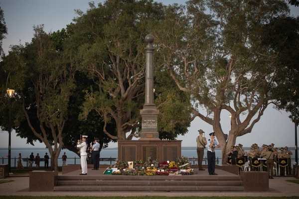 Australian Defence Force service members as part of a catafalque guard perform a rifle salute during an Anzac Day dawn ceremony in Darwin, NT, Australia, 25 April 2021. Anzac Day originally commemorated the Australian and New Zealand Army Corps forces from World War I, but now also recognizes the men and women who have served in the Australian and New Zealand armed services in all wars, conflicts, and peacekeeping operations. Photo courtesy of US Marine Corps / Sgt. Micha Pierce.