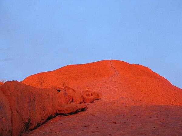 Uluru / Ayers Rock changes colors throughout the day; this is its base at sunset.