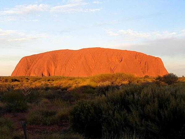 Uluru / Ayers Rock is an inselberg, or island mountain, found in the Northern Territory near Alice Springs - in the middle of Australia&apos;s Outback.  It is a large sandstone rock formation that the aborigines of the area hold sacred.
