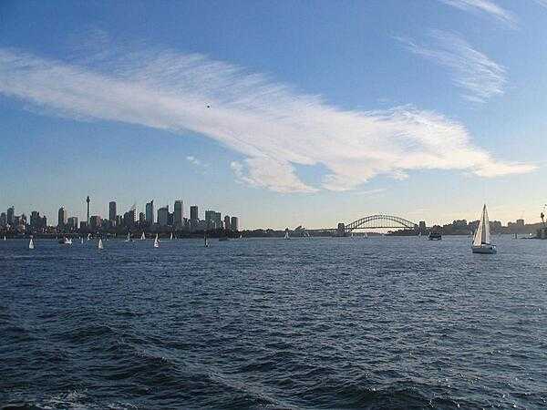 View of Sydney&apos;s Harbor and skyline from a boat.