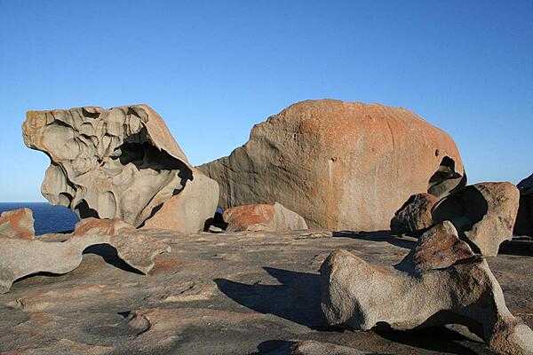 Remarkable Rocks on Kangaroo Island, South Australia, are natural sculptures - some over 7 m (22 ft) tall - formed by wind, rain, and sea spray.