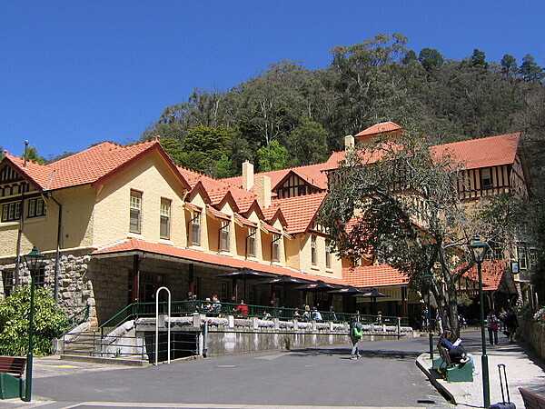 The historic Jenolan Caves House hotel, built in stages between 1879 and 1926, offers a range of accommodations to tourists visiting the Blue Mountains National Park area.
