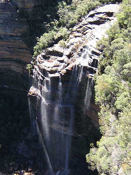 Wentworth Falls is a three-tiered waterfall  (187 m (614 ft) in height) fed by the Jamison Creek in the Blue Mountains region of New South Wales; it is situated approximately 100 km west of Sydney  and about 8 km east of Katoomba.