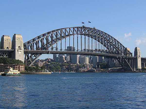The Sydney Harbour Bridge is a steel through-arch bridge across Sydney Harbour that carries rail, vehicular, bicycle, and pedestrian traffic between the Sydney central business district and the North Shore.