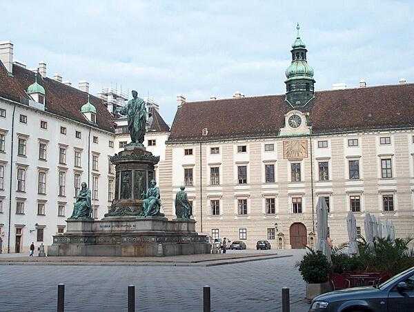 The Amalienburg section of the Hofburg (Imperial Palace) in Vienna. Of note is the small domed tower underlain by an astronomical clock. The statue honors Holy Roman Emperor Francis II (r. 1792-1806), who was also Austrian Emperor Francis I (r. 1804-1835), thus making him the only double emperor in history.