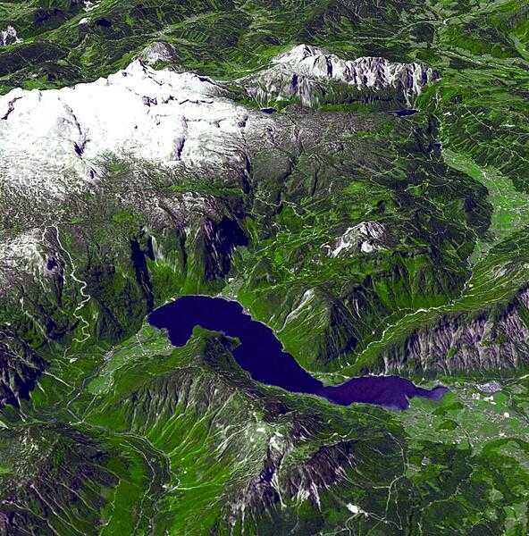 This perspective view from the ASTER instrument aboard the NASA Terra spacecraft shows some of the magnificent natural landscape of the Austrian Salzkammergut region - renowned for its mountains and lakes. North is to the right and Hallstadt lies near the "top" (southwest) where the lake narrows, tucked into the lake shore. Image courtesy of NASA.