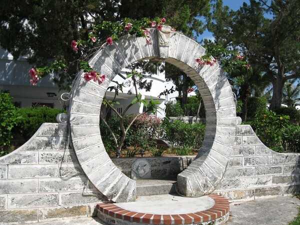 An iconic symbol of Bermuda are its moongates which trace their roots back to China. The structures are believed to bring good luck, prosperity, and joy to those who pass under them and make a wish. Bermuda's moongates began in 1860 when a local sea captain visited a Chinese garden and returned to the island with plans to build one. Incorporation of the whimsical gates into Bermudian architecture took off in the 1920s and today there are 40 of them across the island on private and public property.