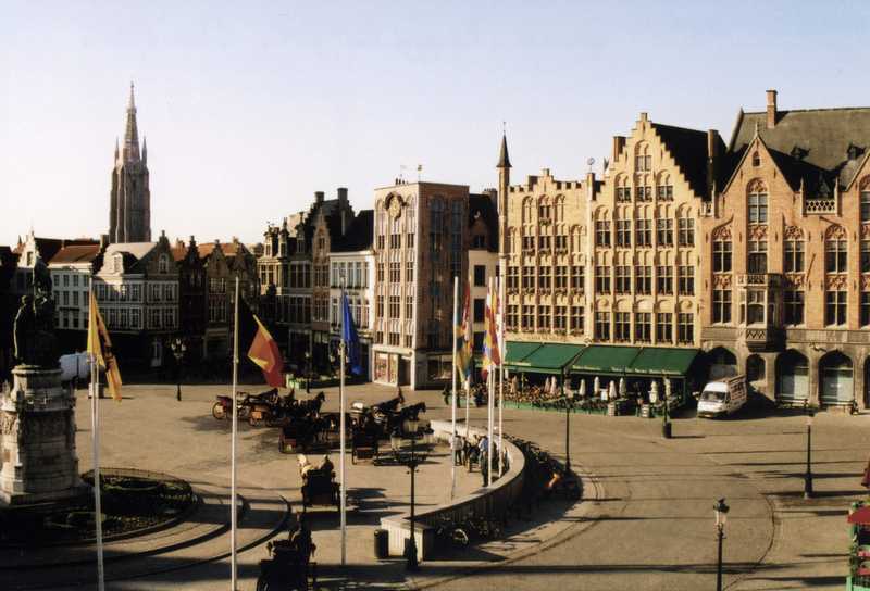 The expansive Market Square in Brugge (Bruges). The city is famous for its lace industry and canals. Market Square is the central gathering point for tourists and shops.