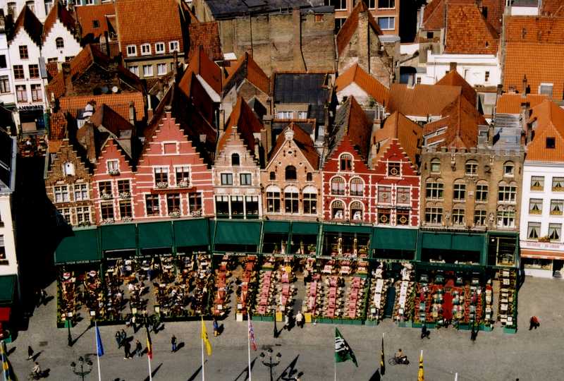 Outdoor cafes in the Brugge (Bruges) Market Square as seen from the Belfort, the city's medieval belfry.