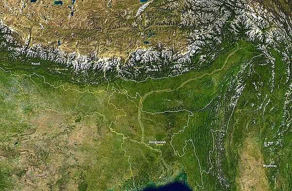 Satellite image showing Bangladesh and nearby countries. Bangladesh itself is bordered by India on its east, north, and west sides, and by Burma on the southeast. The snow-covered mountain chain is the Himalayas;  to their north lies the Tibetan Plateau. Image courtesy of NASA.