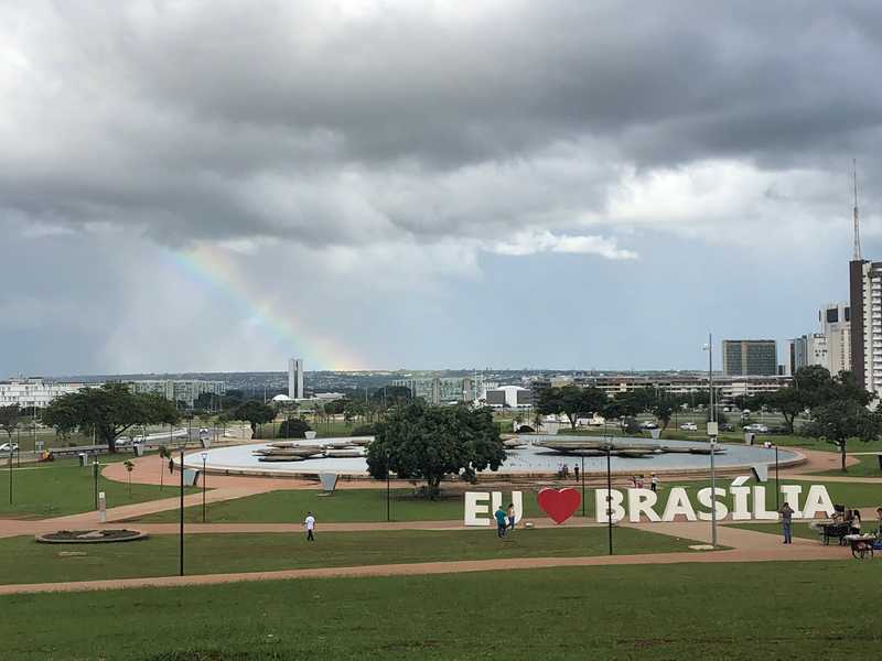 Brasilia is a planned city designed in the 1960s to be a modern Brazilian capital. The center of the city hosts a long mall with fountains and parks. From the hill at the center of the mall, you can see all the way to the Brazilian Parliament Building.
