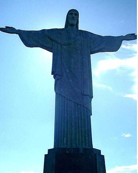 The Christ the Redeemer statue in Rio de Janeiro, Brazil, standing 30 m (98 ft) tall and its outstretched arms spanning 28 m (92 ft), was constructed on Mount Corcovado in celebration of the centenary of Brazilian independence. Built between 1922 and 1931, the statue is made of reinforced concrete and covered with thousands of triangular soapstone tiles. It is the largest Art Deco-style statue in the world and stands on a square stone pedestal 8 m (26 ft) high that is situated on a deck atop the mountain’s summit. For the statue’s 75th anniversary in 2006, a chapel at its base was consecrated to Our Lady of Aparecida, the patron saint of Brazil. The Christ the Redeemer statue became a UNESCO World Heritage Site in 1973 and was voted one of the New Seven Wonders of the World.