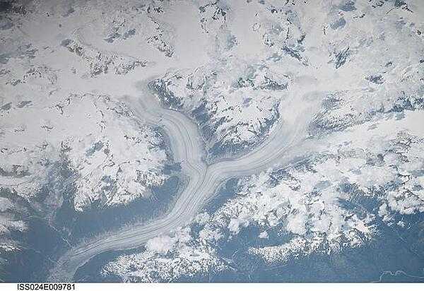 The snow-covered Coastal Mountains of British Columbia are featured in this image taken from the International Space Station. The long smooth areas are glaciers. Photo courtesy of NASA.