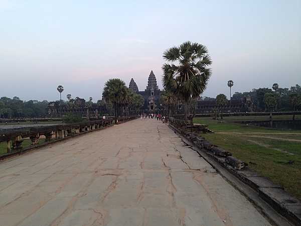 A broad causeway leading up to a temple at Angkor Wat.
