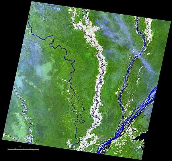 Because of its geographic isolation, the Cuvette Region in the northern part of the Republic of the Congo relies on rivers for transportation. From left to right, the Sangha, Likouala-aux-Herbes, Ubangi, and Congo Rivers are shown in this satellite photo. Agricultural plots dot the landscape. Crops grown in the Cuvette Region include cassava, bananas, plantains, pulses, and groundnuts. Image courtesy of NASA.