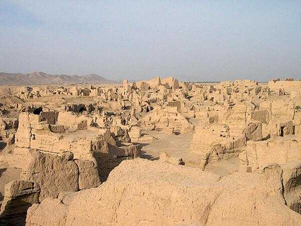 The ruins of Jiaohe in the Yarnaz Valley 10 km (6 mi) west of Turpan. An important site along the Silk Road, the city was situated on an islet in the middle of a river, which served as a natural barrier and enabled the city to be built without walls. From 108 B.C. to A.D. 450 it was the capital of the Anterior Jushi Kingdom; later, it became a prefecture capital until it was destroyed by the Mongols in the 13th century.