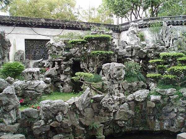 Yuyuan Garden in Shanghai dates to the Ming Dynasty (14th-17th centuries). Its two hectares (five acres) display a variety of sights including caves, grottoes, and a 14 m (46 ft) artificial mountain.