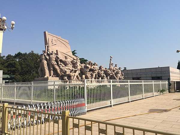 Revolutionary monument in front of Chairman Mao Zedong Mausoleum on Tiananmen Square.