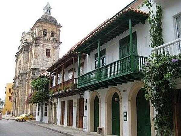 Street scene in the northern city of Cartagena. Because of the mild climate and abundance of wildlife in the area, settlement around Cartagena goes back to 7000 B.C. The city&apos;s colonial walled section and fortress have been designated a UNESCO World Heritage site.