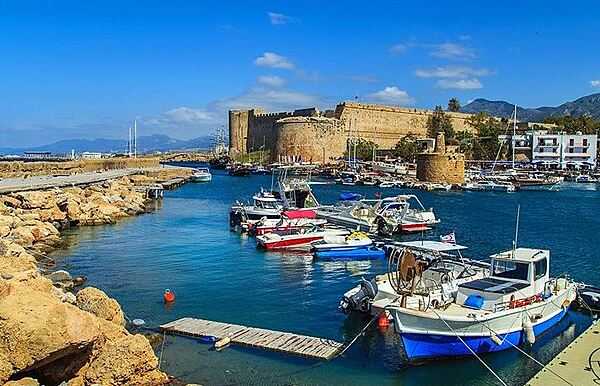 Kyrenia (Turkish: Girne) is a city on the northern coast of Cyprus.  A market center and seaside resort, its horseshoe-shaped harbor is flanked by a 12th-century castle fortress.