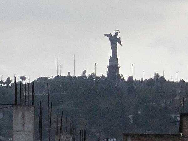 The Virgin of the Apocalypse statue overlooking historic Quito from El Panecillo hill.