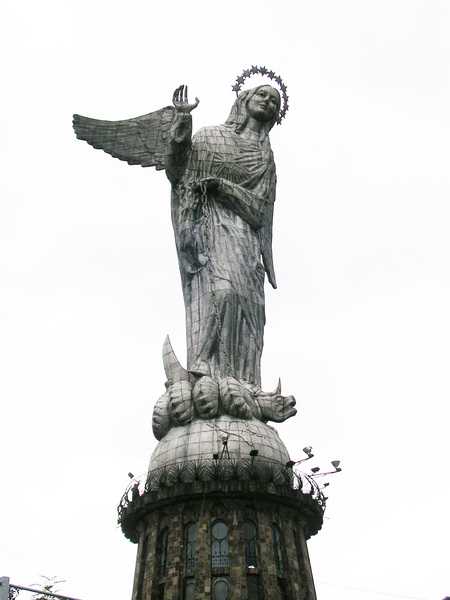 A statue of the Virgin of the Apocalypse on El Panecillo (Bread Loaf Hill) overlooking Quito. The 45 m- (148 ft-) tall aluminum statue depicts the Virgin Mary with wings.