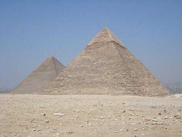 The Pyramids of Khufu (left) and Khafre on the Giza Plateau outside of Cairo. The former, also known as the Great Pyramid, is the largest of the pyramids and is the only one of the Seven Wonders of the Ancient World still extant.