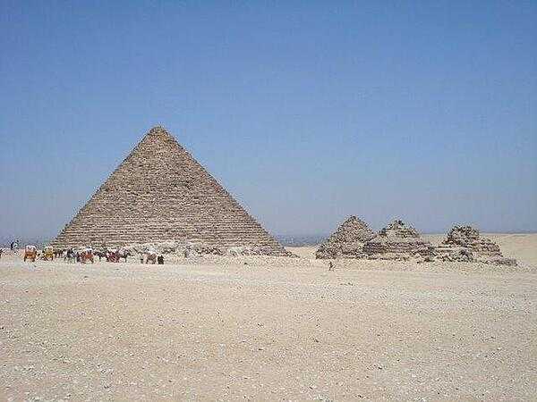 The Pyramid of Menkaure at Giza is flanked by the smaller pyramids of his wives.