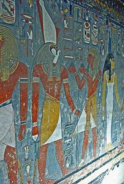 Presenting gifts to the god Horus wearing the double crown (white crown of Upper Egypt, red crown of Lower Egypt). The paint on this tomb wall remains vivid.