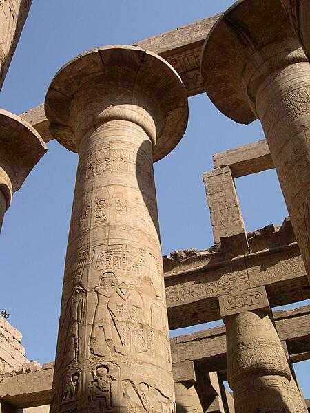 Some of the beautifully decorated columns of the Great Hypostyle Hall, part of the Karnak temple complex at Thebes. The Karnak religious site was the largest in the ancient world - it is sometimes referred to as the Vatican of Egypt - and was composed of four precincts - the one to Amun-Re is the only one open to the public.
