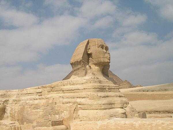 The Great Sphinx, a reclining lion with a human head, is the oldest known monumental sculpture in the world. It is believed to have been carved about 2500 B.C. and most probably depicts the Pharaoh Khafre. The nose of the sphinx has eroded over time.