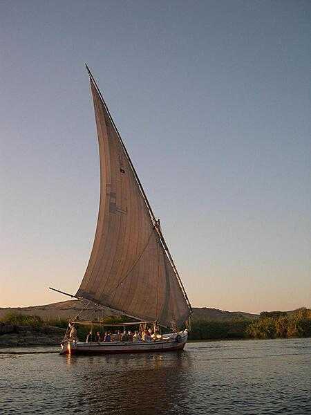 A felucca, an Egyptian sailboat, on an evening cruise on the Nile.