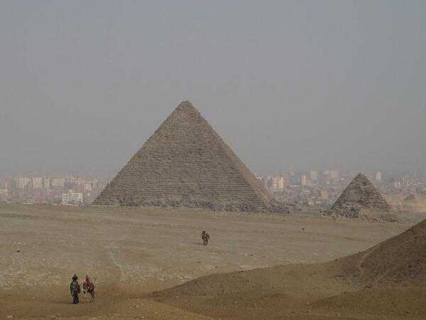 The Pyramid of Menkaure is the smallest of the three kings&apos; pyramids on the Giza Plateau. The city of Cairo appears in the background.