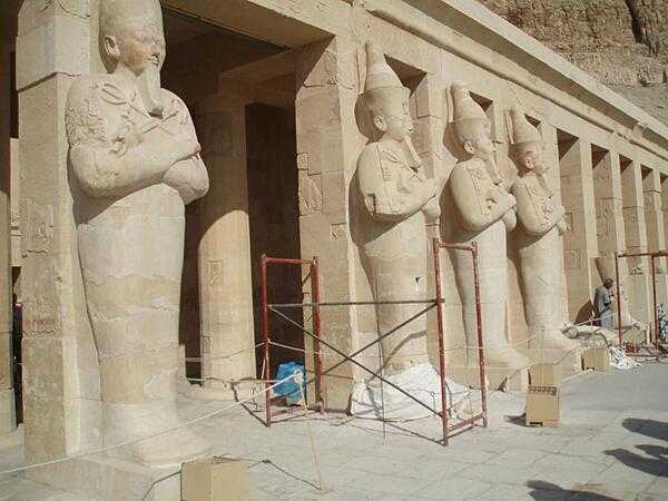 Statues of Hatshepsut as the god Osiris before the Mortuary Temple of Hatshepsut at Deir al-Bahri.