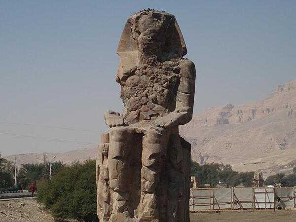 The second of a pair of 30-meter (50-ft) statues of Amenhotep III in the Theban Necropolis on the west bank of the Nile opposite Luxor.