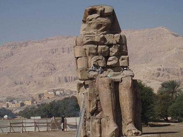One of a pair of 30-meter (50-ft) statues of Amenhotep III that once stood before the pharaoh&apos;s mortuary temple in the Theban Necropolis on the west bank of the Nile opposite Luxor. The rest of the temple was dismantled, and the materials used for other construction projects. The statues were called the &quot;Colossi of Memnom&quot; by Egypt's late Ptolemaic (Greek) rulers who associated them with the myth of Memnon.