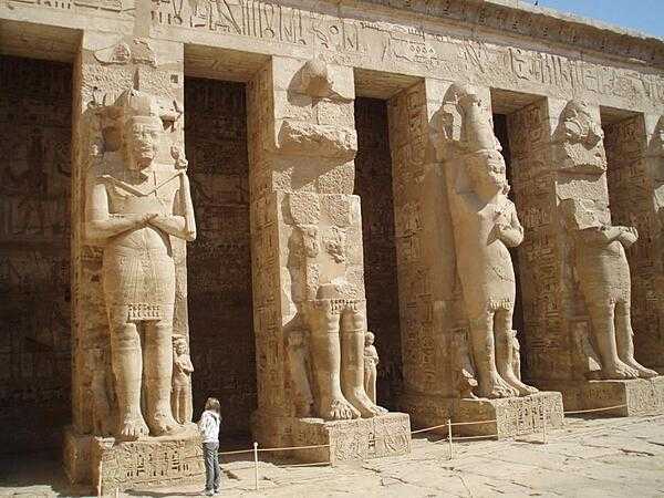 Statues in the hypostyle hall of the Mortuary Temple of Ramses III at Medinet Habu.