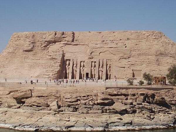 The Temple of Queen Nefertari at Abu Simbel. The temple was dedicated to the god, Hathor. The temple stands 100 m (328 ft) to the right of the Temple of Ramses II. It is fronted by six colossal 10-meter (33-foot) statues of Ramses II and Nefertari. It was unusual that the two statues of the queen were the same height as the four statues of the king. It also was unusual that a temple was dedicated to a queen.