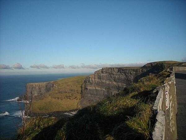 The Cliffs of Moher in County Clare range from 120 m (394 ft) at Hag&apos;s Head to their maximum height of 214 m (702 ft) above the Atlantic Ocean just north of O&apos;Brien&apos;s Tower. Comprised of mainly shale and sandstone, the cliffs are home to large colonies of Atlantic Puffins.