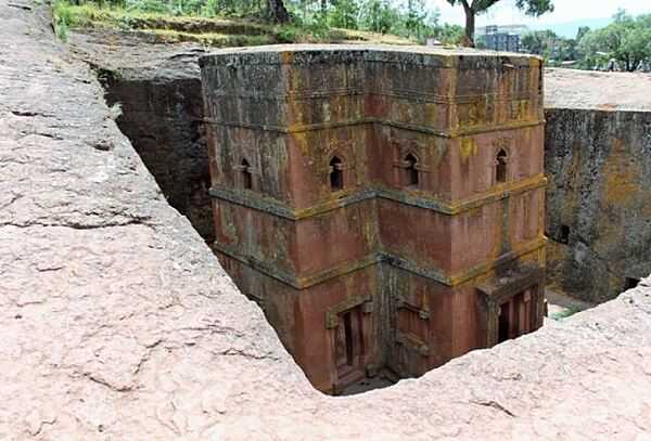 Ethiopia was one of the earliest nations to adopt Christianity in the first half of the 4th century. In the 12th and 13th centuries, in a mountainous region now called Lalibela, eleven medieval monolithic churches were carved out of rock (pictured is the Church of Saint George). The layout and names of the major buildings are widely accepted to be a symbolic representation of Jerusalem. In 1978, UNESCO declared the churches a World Heritage Site.