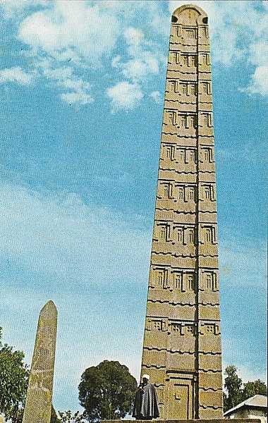 King Ezana's Stela is a 21 m- (69 ft-) tall obelisk in the ancient city of Axum. The monument, which dates to the 4th century A.D., stands at the center of the Northern Stelae Park along with hundreds of smaller and less decorated stelae. It is decorated with a false door at its base, and apertures resembling windows on all sides. The obelisk’s semi-circular apex used to be enclosed by metal frames. In 2007-08, the stela was structurally consolidated and today is braced to prevent its leaning any further.
