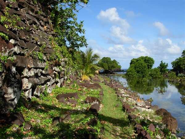 An image that presents a good idea of the Nan Madol setting: immense basaltic structures overhung with vegetation, shallow interconnecting canals, and the ocean expanse beyond. Photo courtesy of NOAA.